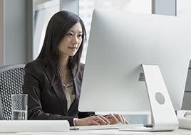 Woman typing on computer