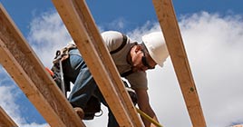 Contractor working on wooden frame