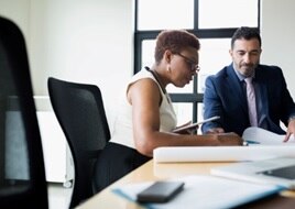 Man and woman filling out paperwork