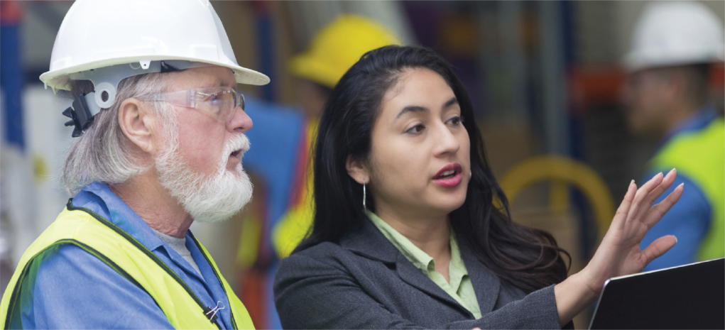 Woman and man in factory talking