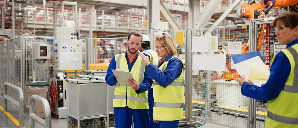 Man and woman in factory performing risk survey