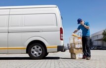 Delivery man speaking on phone