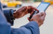 Person scrolling on phone with finger