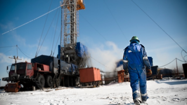 Person walking towards mine while wearing safety equipment